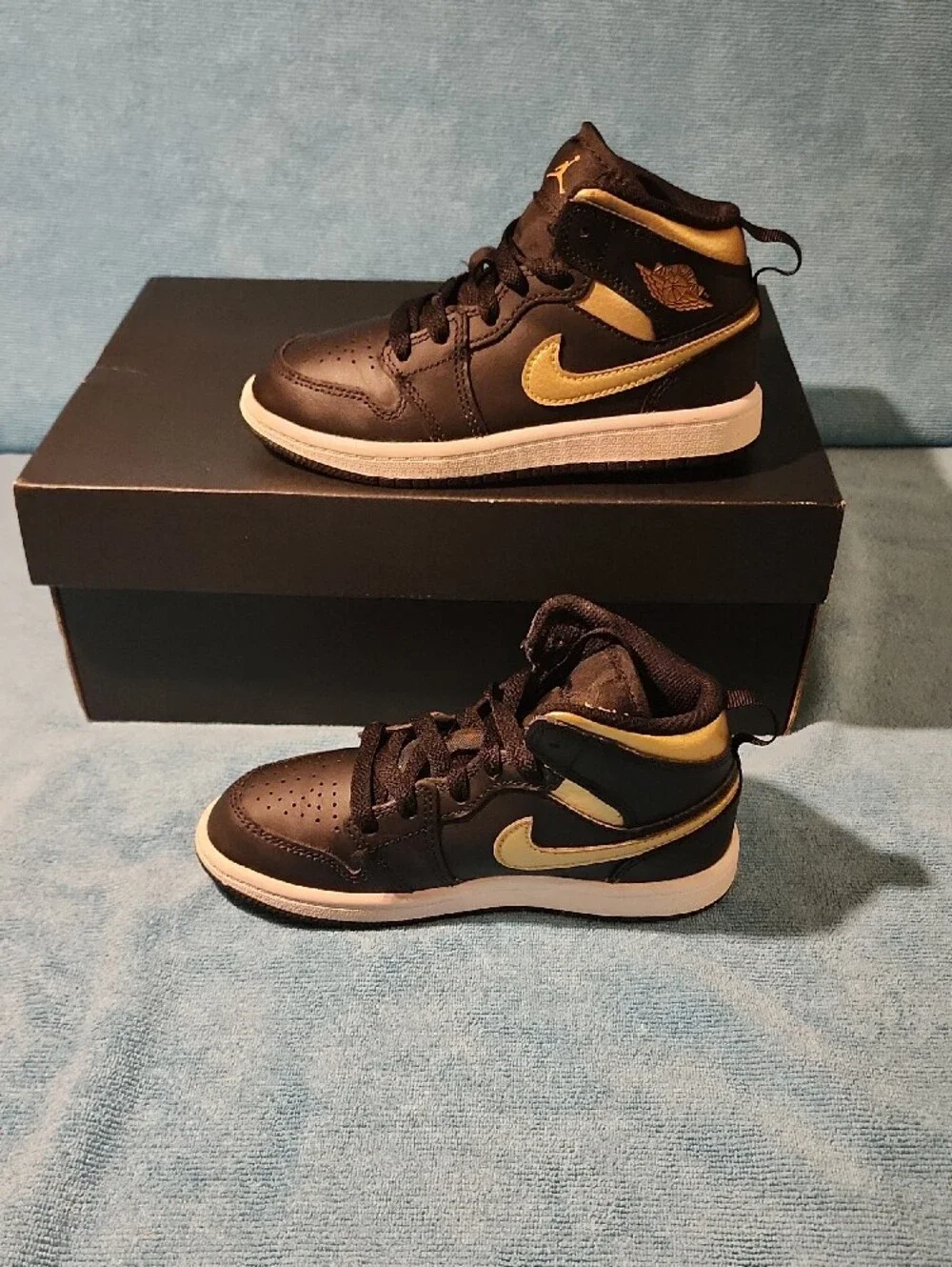 Jordan Black and Metallic Gold Mid-Top Sneakers